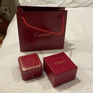 Selling Cartier bag that is rendered with a purchase along with ring box.